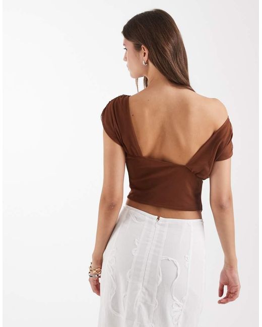 Gemini di laagam in Brown