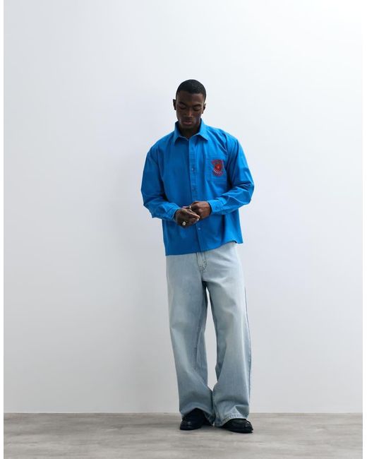 Reclaimed Vintage Blue Oversized Relaxed Shirt With Logo for men