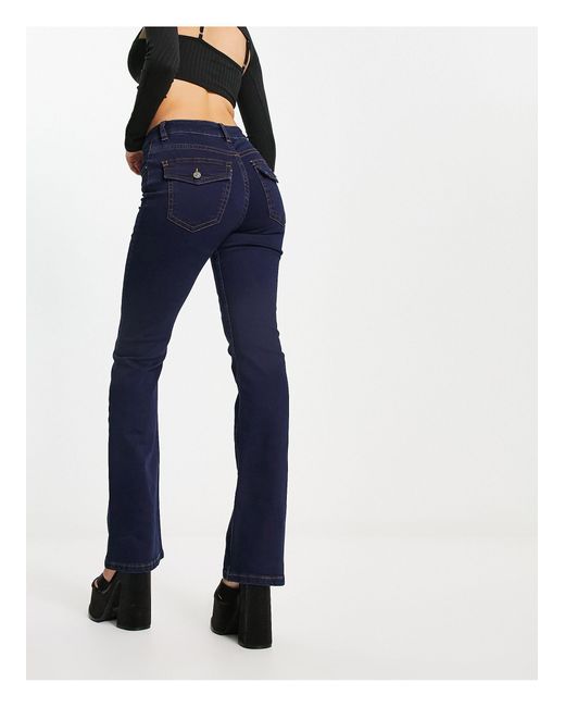 ASOS Flared Jeans Met Lage Taille En Western Zakken in het Blauw | Lyst NL