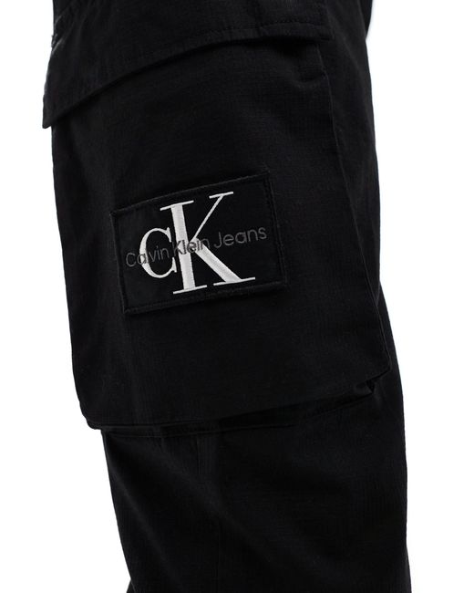 Pantaloni cargo skinny neri di Calvin Klein in White da Uomo