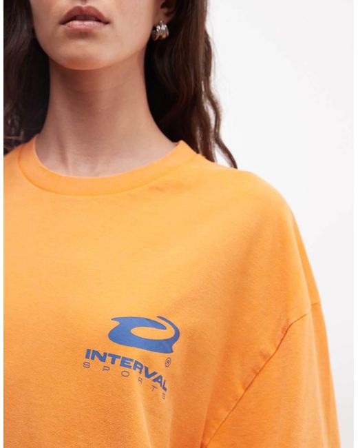 Collusion Orange Unisex Long Sleeve T-shirt With Blue Print