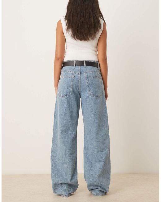 Jean baggy en coton texturé à taille basse - clair Mango en coloris Blue