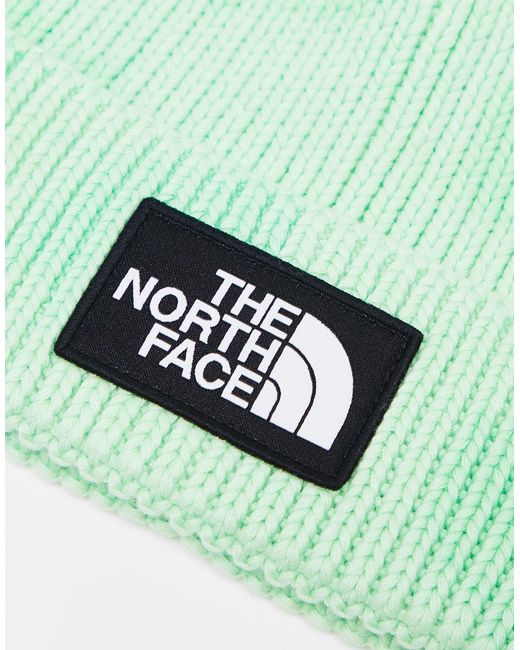 The North Face Green – strickmütze mit em batikmuster, umschlag und logo-aufnäher