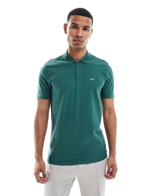 T-Shirt A Maniche Corte Con Logo Sul Petto E Colletto Stile Polo di Hollister in Green da Uomo