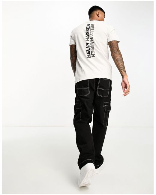 Sloppenwijk Banzai huid Helly Hansen T-shirt Met Groot Logo Op in het Wit voor heren | Lyst NL