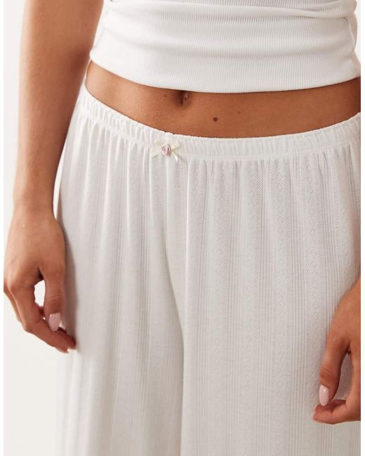 ASOS White Asos Design Petite Pointelle Wide Leg Pyjama Trousers With Rosebud Trim