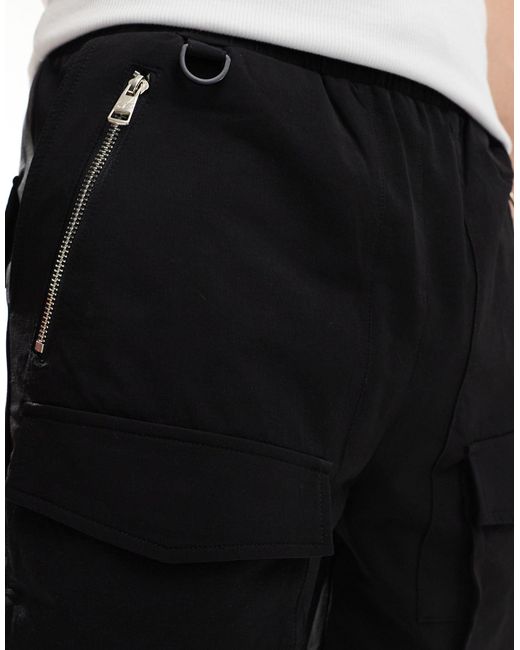 Pantaloncini cargo neri con pannelli a contrasto di The Couture Club in Black da Uomo