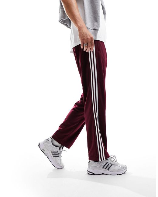 Adicolor - pantaloni sportivi bordeaux di Adidas Originals in Red da Uomo