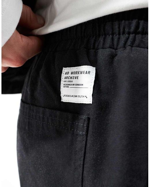 ASOS Toelopende Broek Met Elastische Taille En Opgestikte Achterzak in het Black voor heren