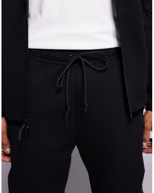 Nike Blue Tech Fleece Reflective Joggers for men