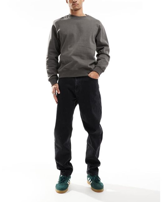Vaqueros Negros De Corte Tapered Holgado Isaac De Tommy Hilfiger de hombre de color Gray