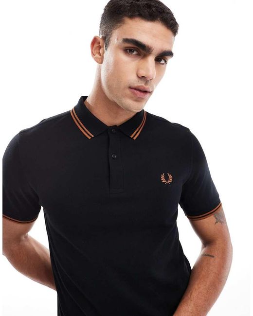 Polo Con Doppia Riga A Contrasto Sui Bordi Nera E Arancione di Fred Perry in Blue da Uomo