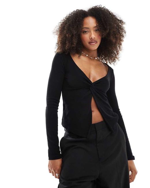 Stradivarius Top Van Jersey Met Knoop Aan De Voorkant En Lange Mouwen in het Black