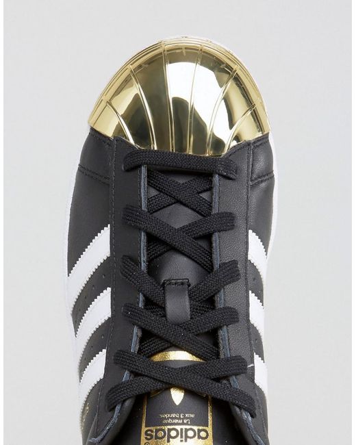 Year parallel do not do adidas Originals Originals Black Superstar Sneakers With Gold Metal Toe Cap  | Lyst