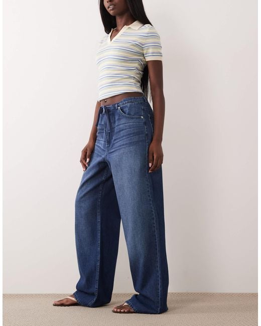 Jean large à enfiler - moyen délavé ASOS en coloris Blue