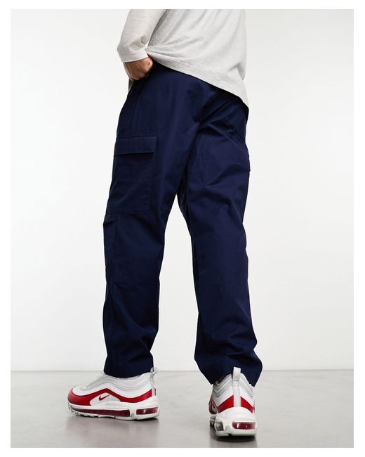 Pantalones cargo club Nike de hombre de color Blue