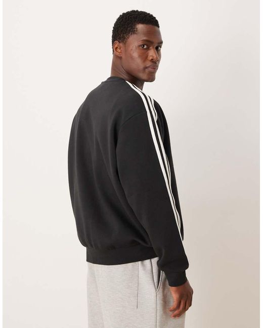 Adidas Originals Black Three Stripe Oversized Sweatshirt for men