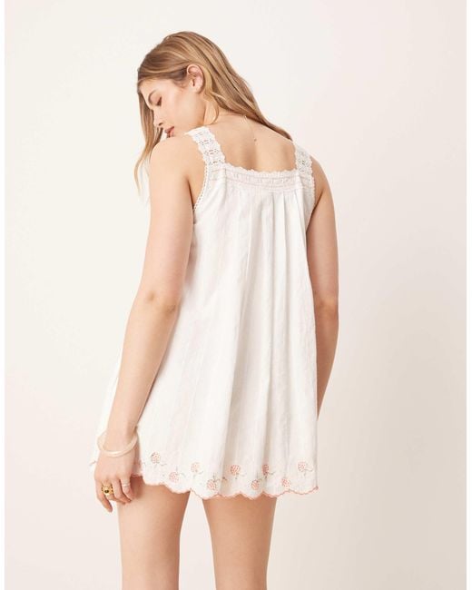 Latecia - robe babydoll courte à détails smockés - ivoire Free People en coloris Natural