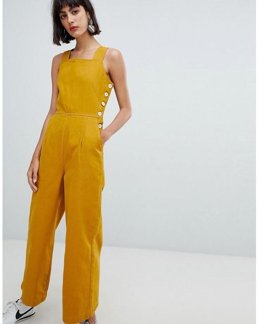 ASOS Yellow Denim Jumpsuit With Side Buttons In Mustard