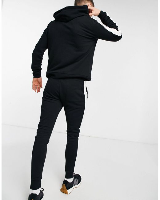 Chándal con raya lateral ASOS de Algodón de color Negro para hombre | Lyst