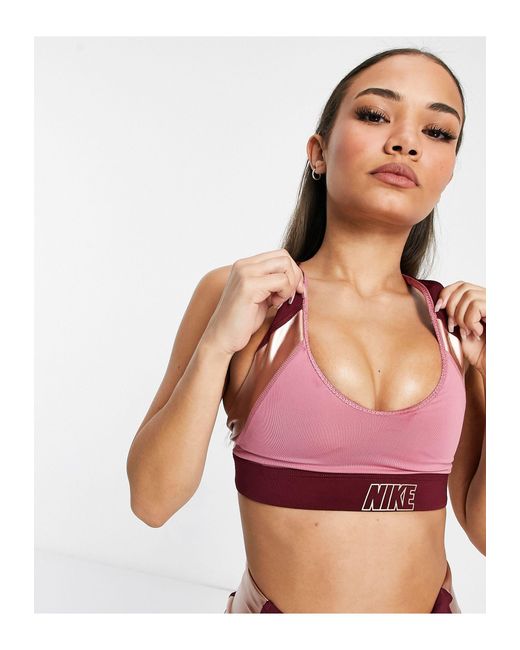 Nike Indy Light Support Logo Metallic Sports Bra in Pink | Lyst