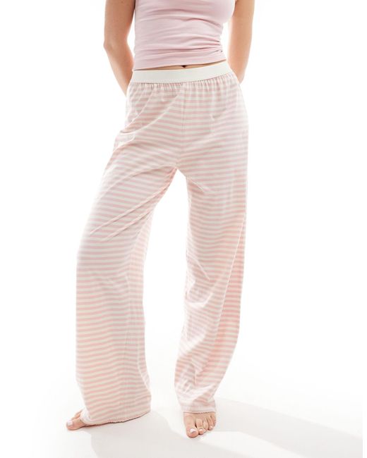 Mix & match - pantaloni del pigiama a righe con fascia di ASOS in Pink