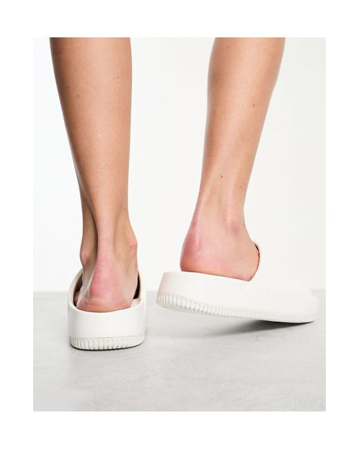 womens white nike sliders