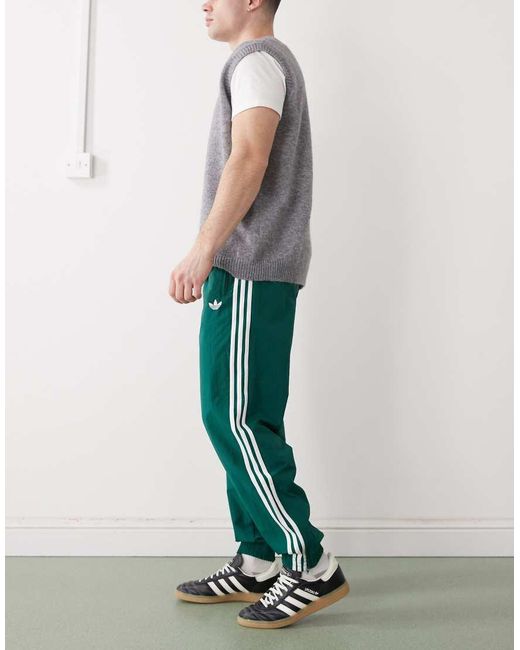 Adidas Originals Green Firebird Woven Track Pants for men