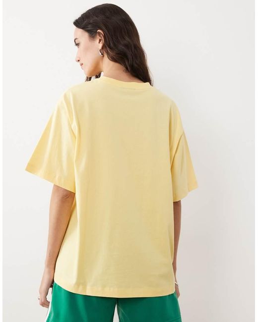 ASOS Yellow Short Sleeve Oversized T-shirt With Running Club Graphic