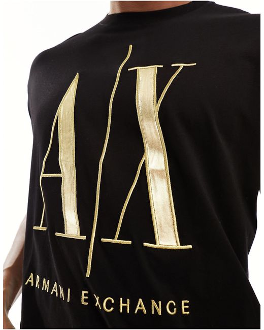 Camiseta negra con logo grande dorado Armani Exchange de hombre de color Black
