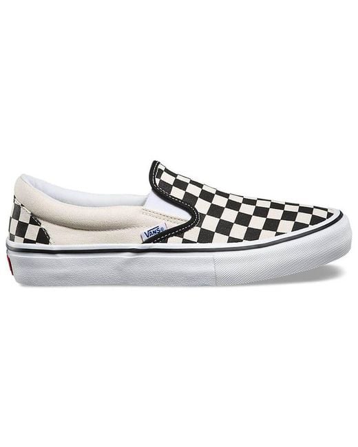 white checkerboard vans