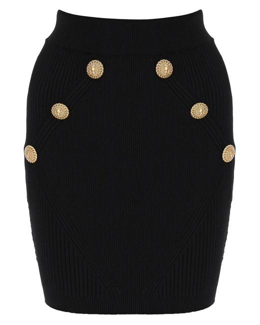 Mini-jupe Knit avec des boutons Embossed Balmain en coloris Black