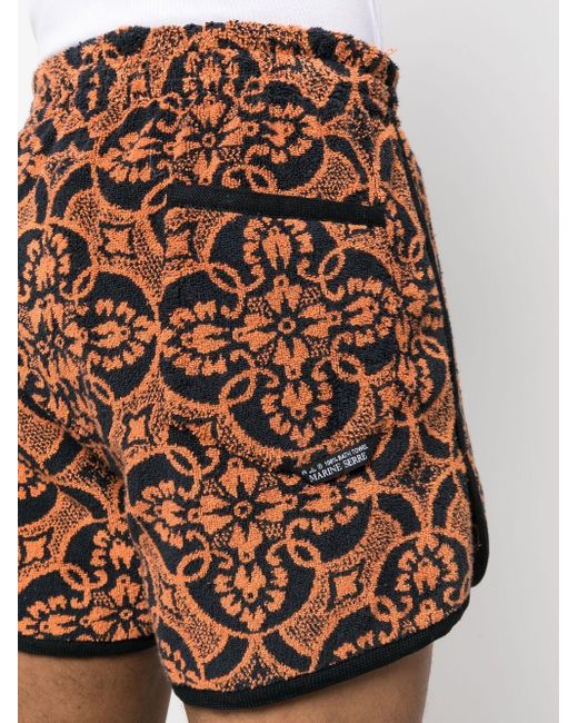 MARINE SERRE Orange Printed Running Shorts for men