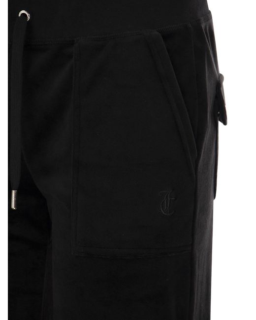 Pantaloni di velluto in cotone succoso couture di Juicy Couture in Black