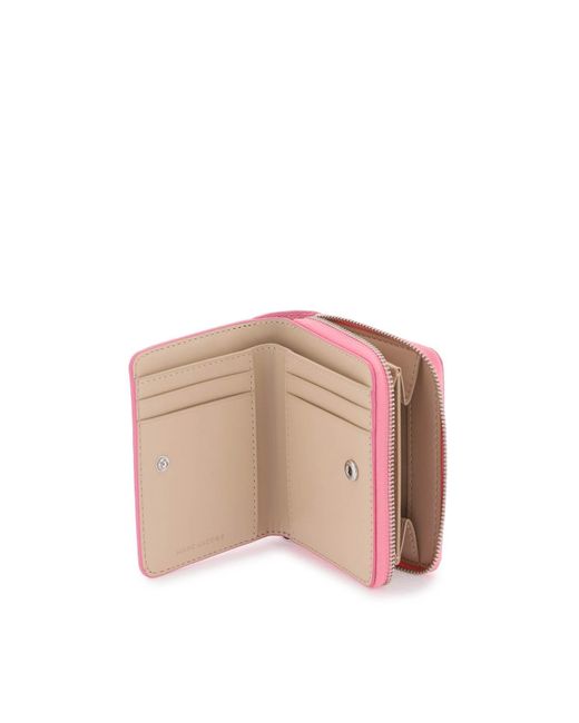 Le mini portefeuille compact en cuir Marc Jacobs en coloris Pink
