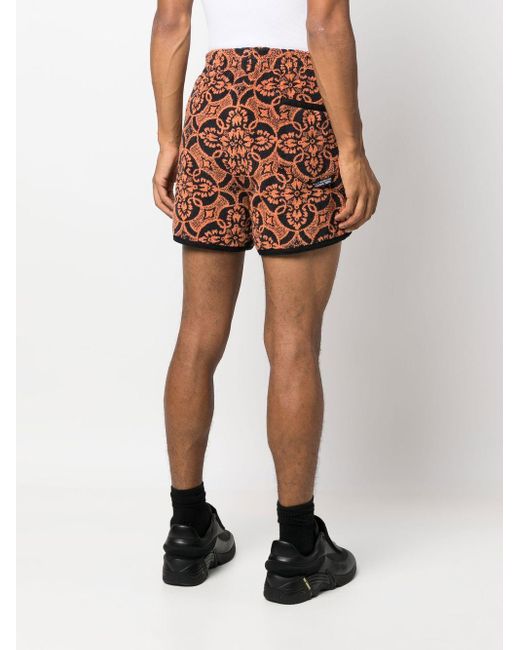 MARINE SERRE Orange Printed Running Shorts for men
