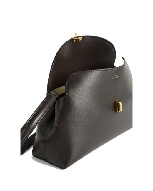 Totême Black T-Lock Leather Clutch Bag
