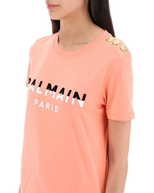 Balmain Pink T -Shirt mit gefährter Druck und goldenen Tonknöpfen