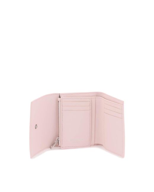 Billetera de cráneo compacto de Alexander McQueen de color Pink