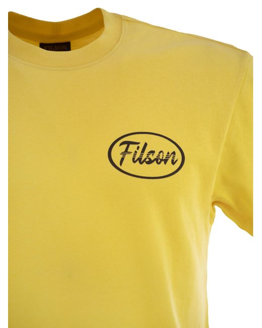 Filson Yellow T -Shirt mit Grafiken auf Brust und Rücken