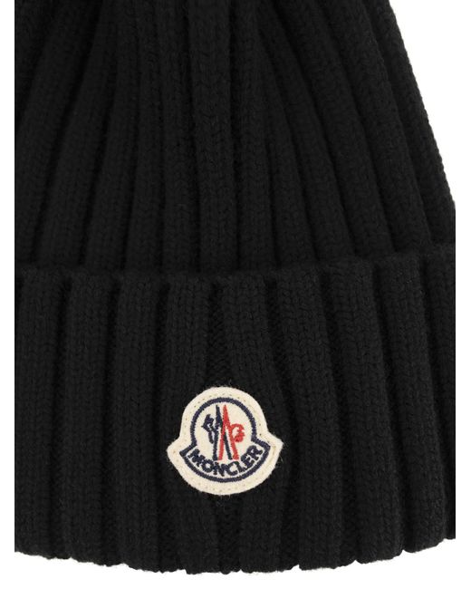 Moncler Black Wollkappe mit synthetischer Pompom