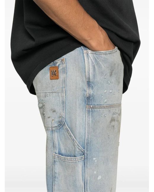 Amiri Blue Jeans With A Distressed Effect for men