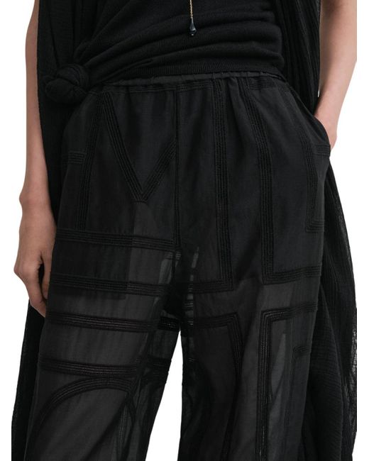 Pantalones de crochet de monograma de en negro Totême  de color Black