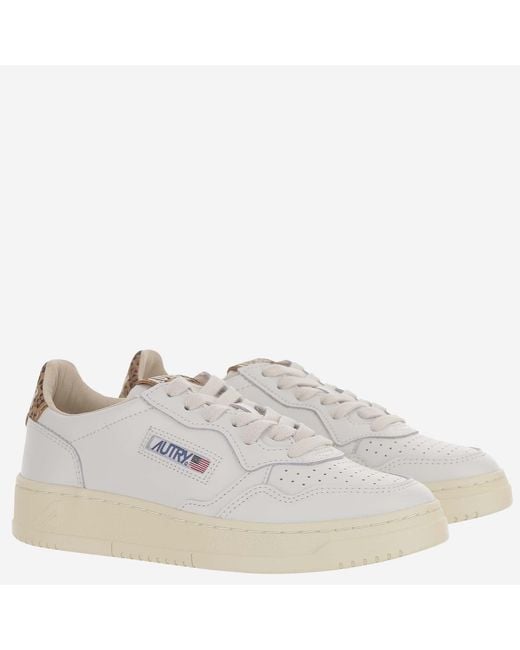 Autry White Low-Top Leather Sneakers With Suede Heel Tab And Logo Accents