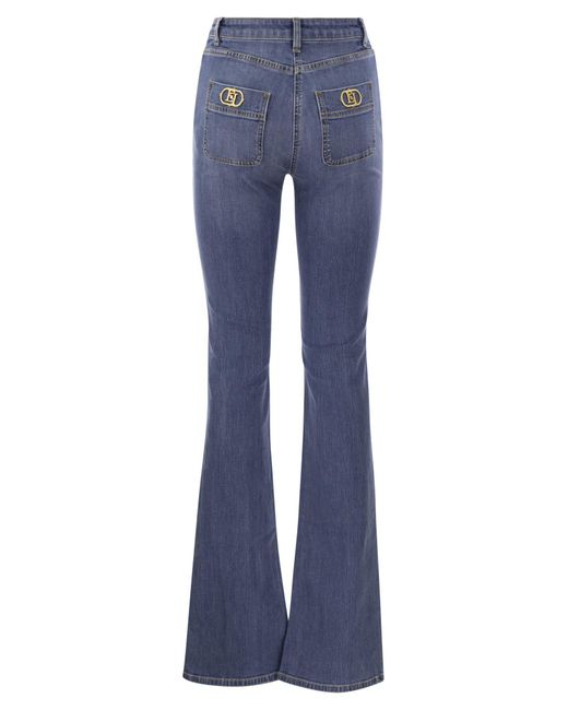 Jeans de patte de franchise Elisabetta avec plaques de logo Elisabetta Franchi en coloris Blue