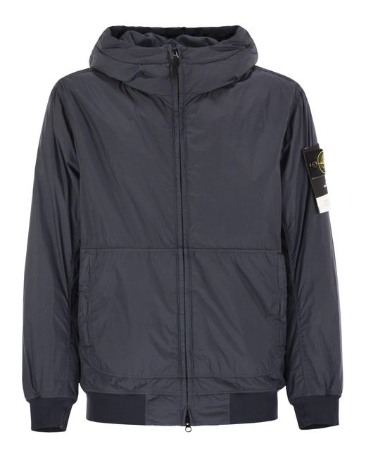 Chaqueta acolchada de con goteo y resistente al viento Stone Island de hombre de color Blue