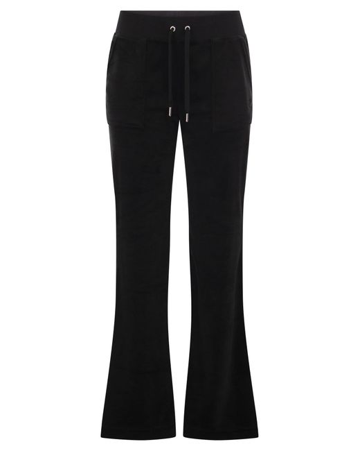 Pantaloni di velluto in cotone succoso couture di Juicy Couture in Black