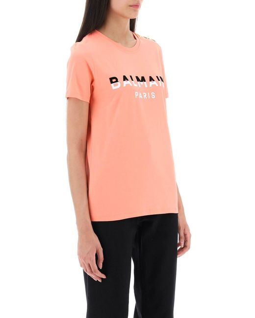 T-shirt avec imprimés afflués et boutons de ton or Balmain en coloris Pink