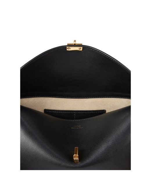 Totême  Black T-Lock Leather Clutch Bag