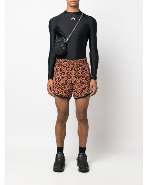 MARINE SERRE Orange Printed Running Shorts for men